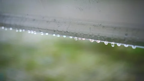 Raindrops Falling and Dripping on a Window Stock Footage 291298161