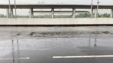 Raindrops falling on the asphalt Stock Footage 296581540