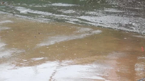 Raindrops falling on asphalt or concrete road surfaces Stock-Footage 327193092