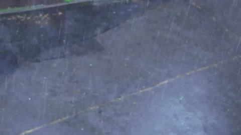 Raindrops falling on the background of the city road Stock Footage 134943653