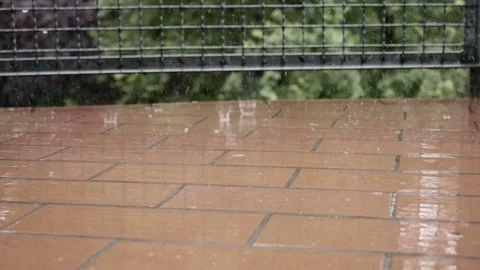 Raindrops falling on balcony floor in slow motion 스톡 동영상 76943796