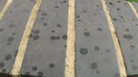 Raindrops falling on to blue bricks Stock Footage 26437425