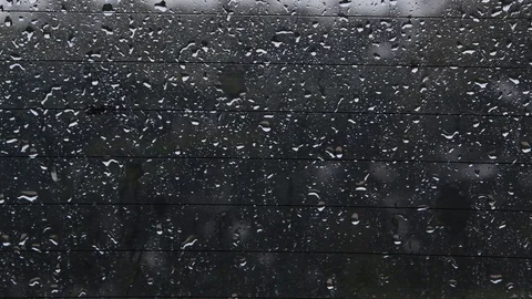 Raindrops falling on car back glass 库存影片 123144979