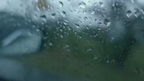 Raindrops falling on car window glass close up Stock-Footage 333622161