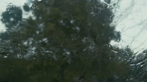 Raindrops Falling on Car Windshield Stock Footage 138715957