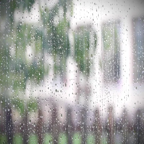 Raindrops falling down the window in a rainy day | with backgound sound Video stock 69650010