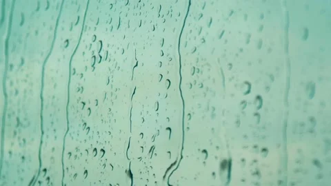 Raindrops falling on the glass 4K Stock Footage 157657093