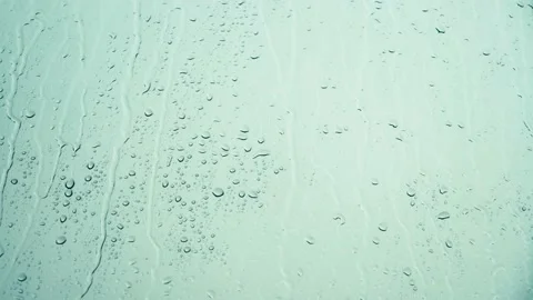Raindrops falling on the glass 4K Stock Footage 157657487