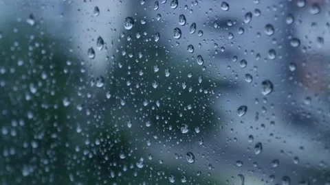 Raindrops falling on the glass 4K Stock Footage 157658015