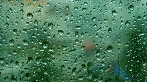 Raindrops falling on the glass 4K Stock Footage 157658163