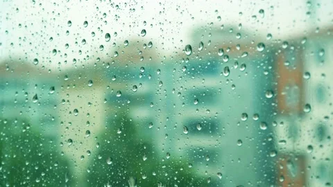 Raindrops falling on the glass 4K Stock Footage 157658535