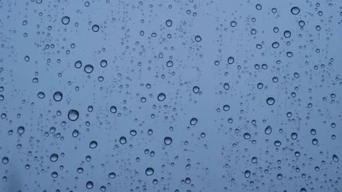 Raindrops falling on the glass 4K Stock Footage 157658573