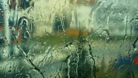 Raindrops falling on the glass 4K Stock Footage 157658729