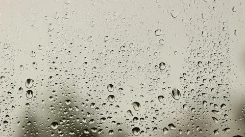 Raindrops falling on the glass in cloudy weather. Stock Footage 109084364