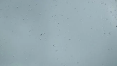 Raindrops falling on the glass in cloudy weather. Rainy autumn weather Stock Footage 140279316