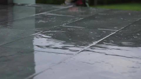 Raindrops falling on the ground Stock Footage 204941353