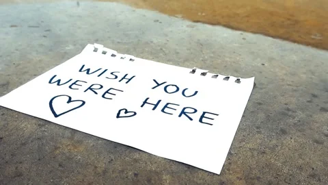 Raindrops falling on a handwritten love note Stock Footage 340551190