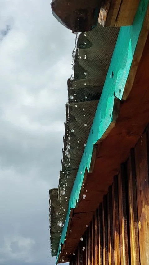 Raindrops falling from the house roof Stock Footage 167481235