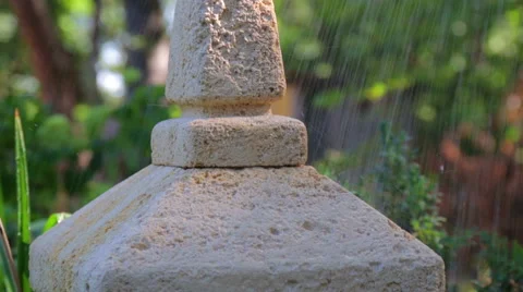 Raindrops falling on the Japanese stone lantern. Stock Footage 53809811