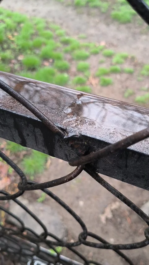 Raindrops falling on metal. metal texture and water. rain and iron mesh. Stock Footage 305445171