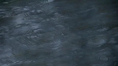 Raindrops falling on neutral ground Stock Footage 221585377