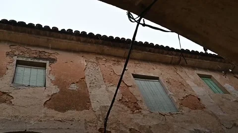 Raindrops falling on an old decadent building facade Stock Footage 320407481