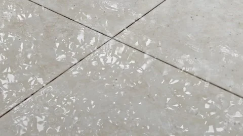 Raindrops Falling on Outdoor Tiled Terrace Floor During Heavy Rain Stock Footage 341957582