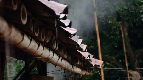 Raindrops falling from the roof of the house Stock Footage 302593705