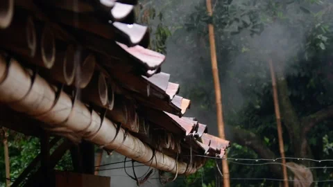 Raindrops falling from the roof of the house Stock Footage 302593718