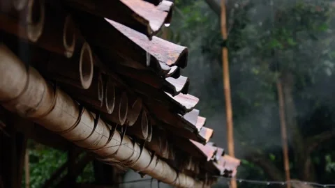 Raindrops falling from the roof of the house Stock Footage 302593727