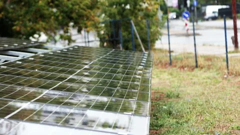 Raindrops falling on solar panels during stormy weather Stock Footage 345437470