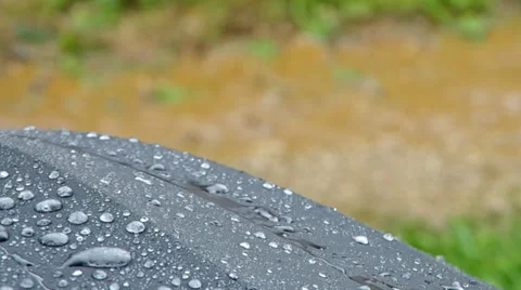 Raindrops falling on an umbrella Stock Footage 38977218