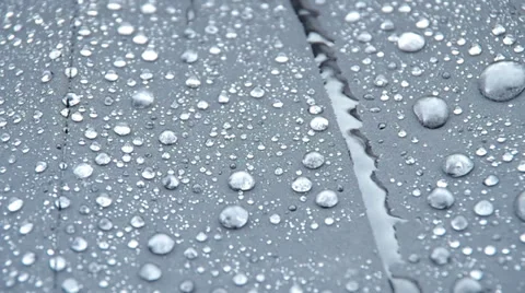 Raindrops falling on an umbrella Stock Footage 38977930