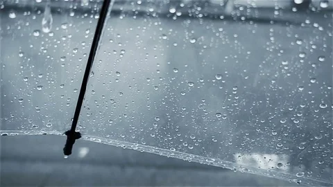 Raindrops falling on umbrella, super slow motion Stock Footage 80082536
