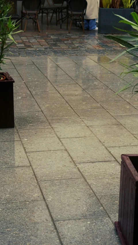 Raindrops falling on wet stone pavement in Tallinn Old Town Stock Footage 340553881