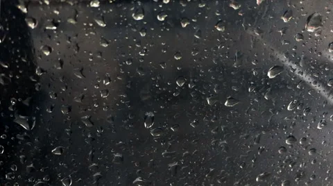 Raindrops falling on window at evening Stock Footage 57021890