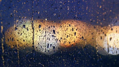 Raindrops Falling on the Window Stock Footage 78810723
