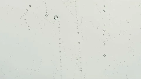 Raindrops falling on the window. Stock Footage 164731727