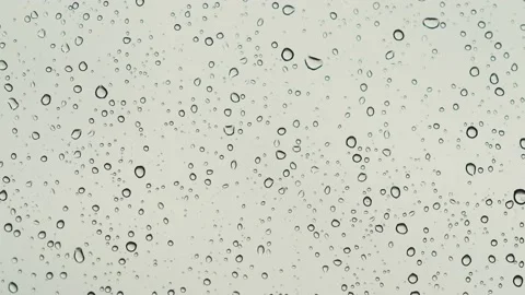 Raindrops falling on the window. Stock Footage 164731786