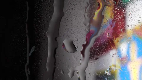 Raindrops falling on the window glass Stock Footage 278684331