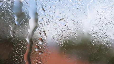 Raindrops falling on the window glass Video stock 278685791