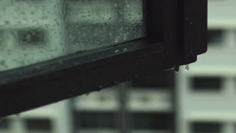 Raindrops Falling on Window Panel Slow Motion Stock Footage 149871625