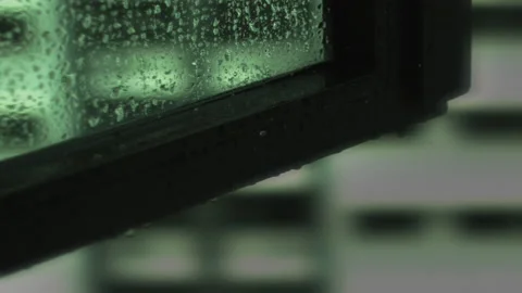 Raindrops Falling on Window Panel Slow Motion Stock Footage 149871632