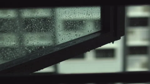 Raindrops Falling on Window Panel Slow Motion Stock Footage 149871737