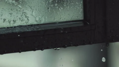 Raindrops Falling on Window Panel Slow Motion Stock Footage 149871852