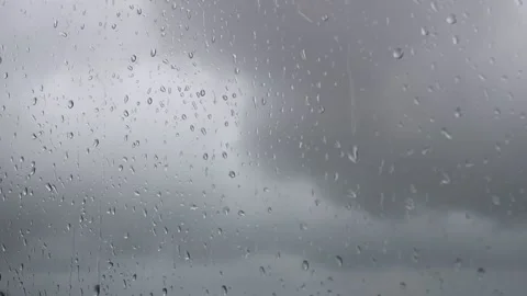 Raindrops falling on the window, rainy dark weather Stock Footage 136032232