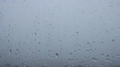 Raindrops falling on the window, rainy weather Stock Footage 135683307