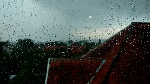 Raindrops falling on the windows of the building on the top floor Stock Footage 182201109