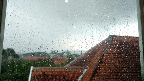 Raindrops falling on the windows of the building on the top floor Stock Footage 182201126