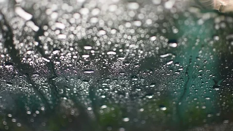 Raindrops falling on windscreen Stock Footage 129436602